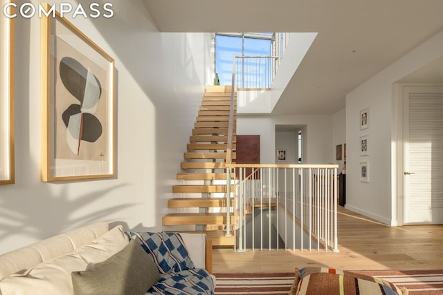 staircase featuring hardwood / wood-style flooring