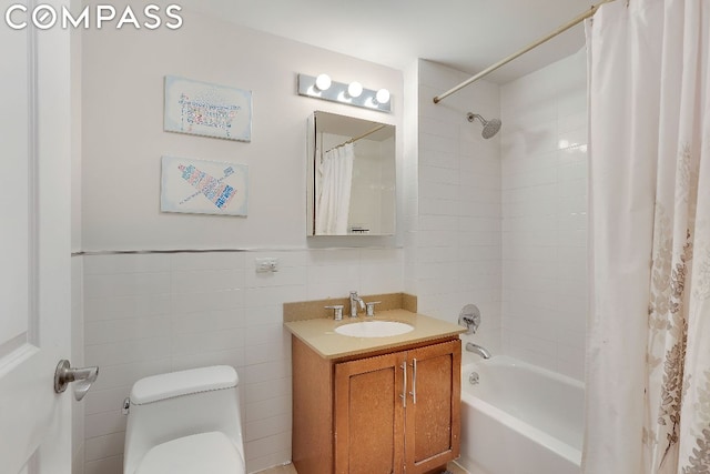 full bathroom featuring tile walls, toilet, vanity, and shower / bathtub combination with curtain