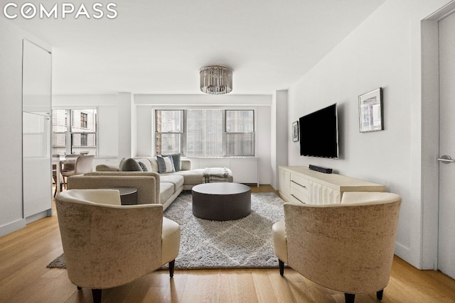 living room with light hardwood / wood-style flooring