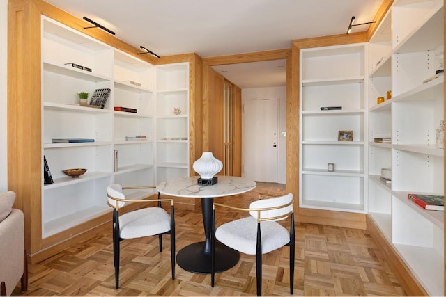 dining space with light parquet floors