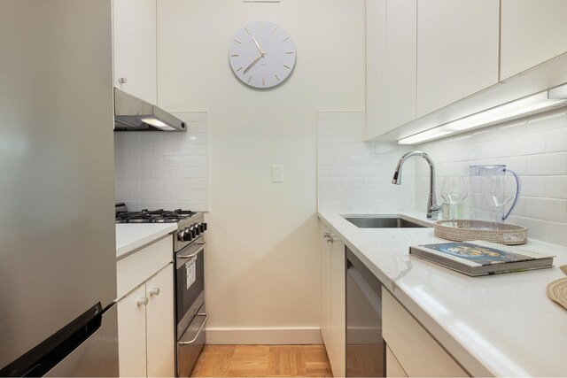 dining area with built in features and light parquet floors