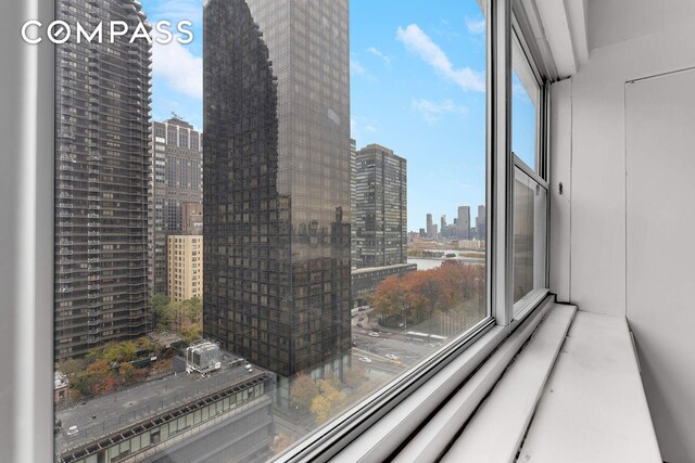 bedroom featuring multiple windows and radiator heating unit