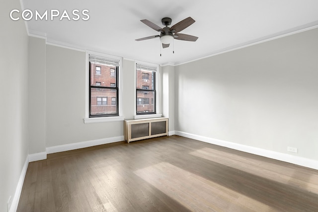 321 E 54th St Unit 10B, New York City, NY 10022 - unfurnished room featuring ornamental molding, dark wood-style floors, and a ceiling fan