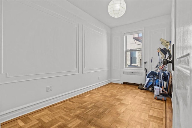 exercise room featuring radiator