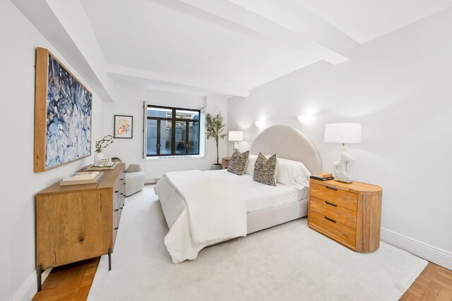 bedroom with beamed ceiling