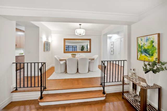 25 W 54th St Unit 8F, New York City, NY 10019 - stairway featuring baseboards and wood finished floors