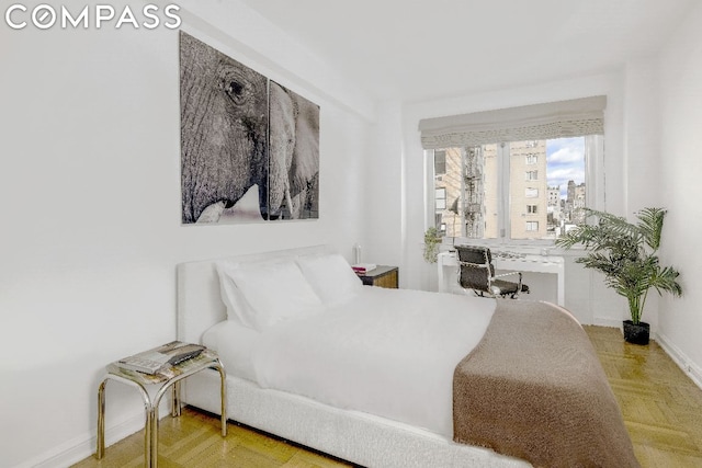 bedroom featuring light parquet floors