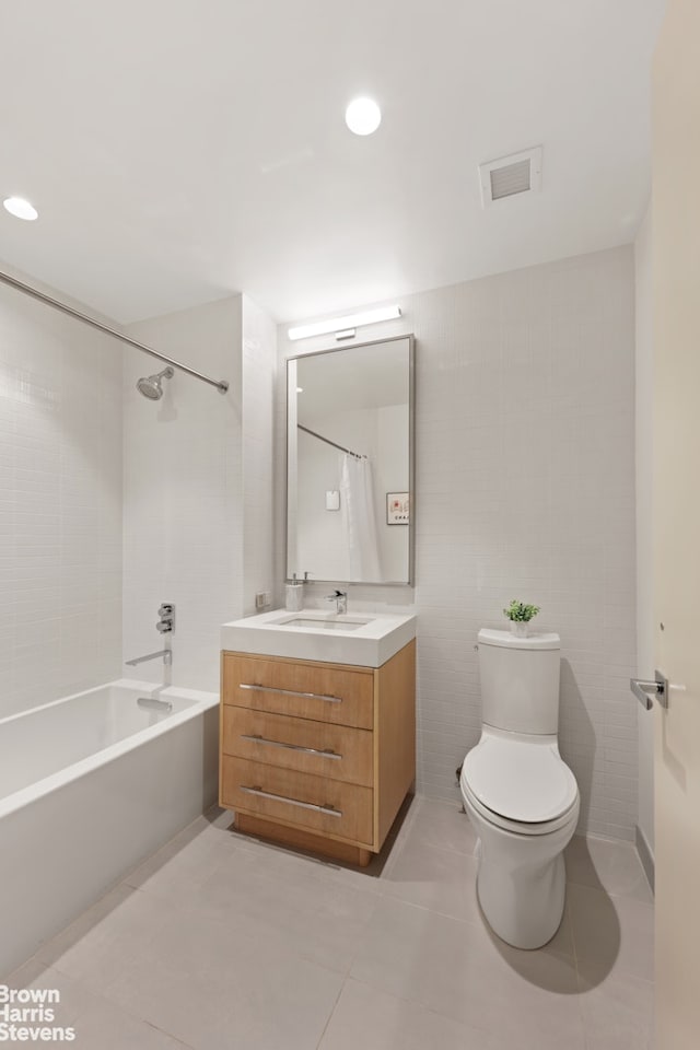 bathroom with bathtub / shower combination, visible vents, toilet, vanity, and tile patterned flooring