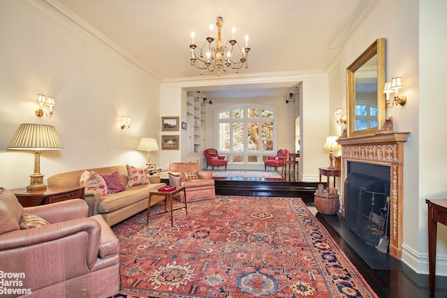 living room with ornamental molding, a chandelier, and wood-type flooring