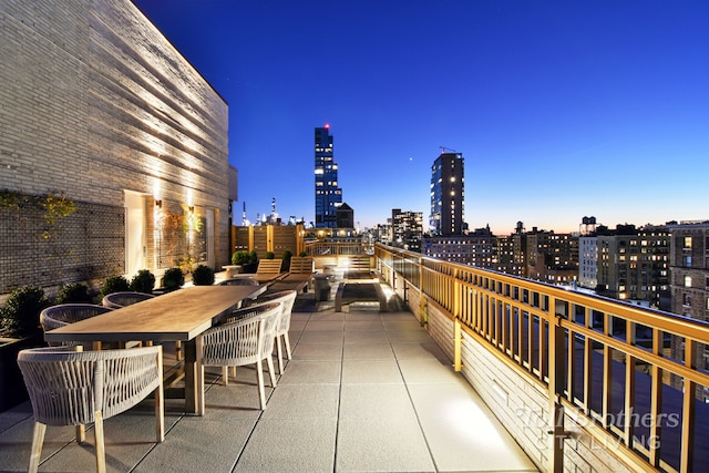 view of patio terrace at dusk