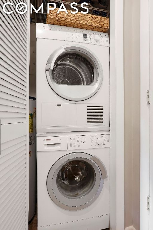 laundry area with stacked washer / drying machine