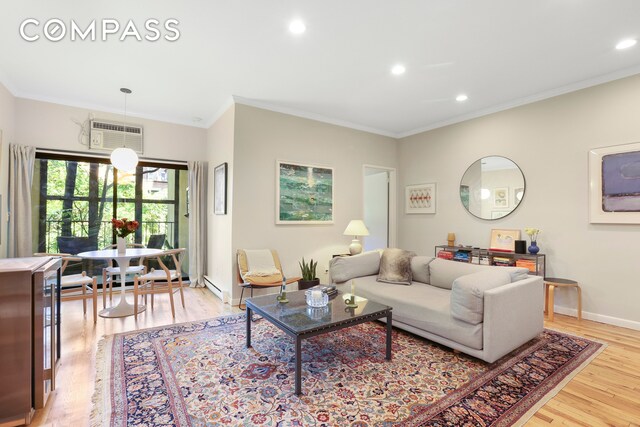 dining space featuring baseboard heating and crown molding