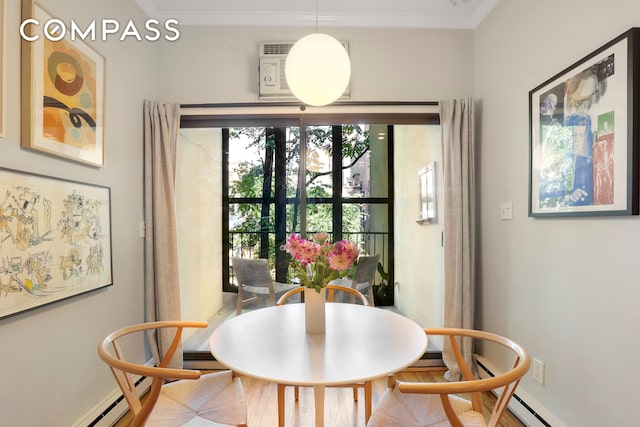 dining area featuring a baseboard radiator and ornamental molding