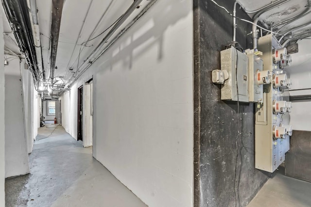 hall featuring concrete flooring