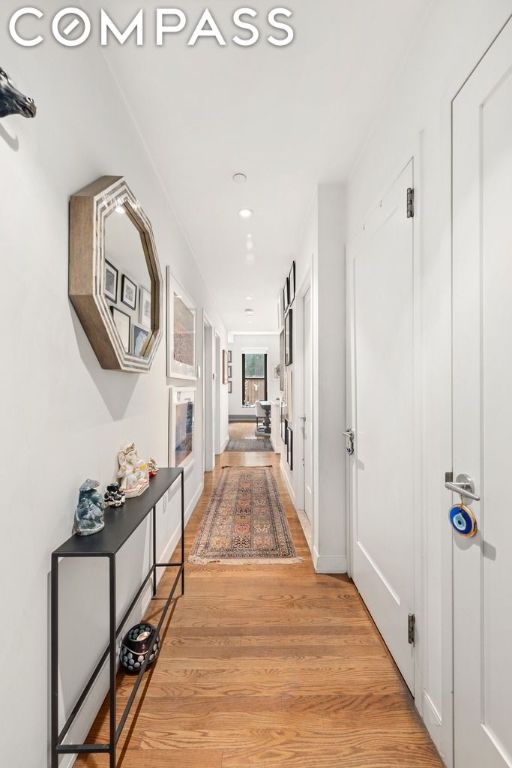 corridor featuring light hardwood / wood-style floors