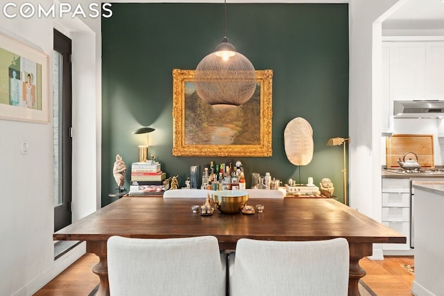 dining area featuring light wood-type flooring