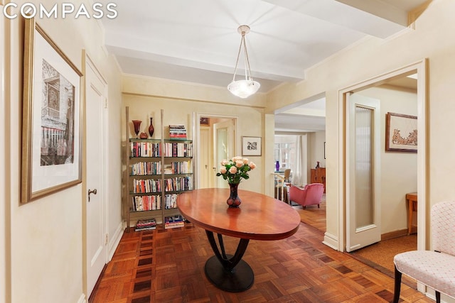 dining room featuring beam ceiling and dark parquet flooring