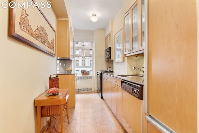 kitchen featuring stainless steel range with electric stovetop, light brown cabinets, dishwasher, radiator, and sink