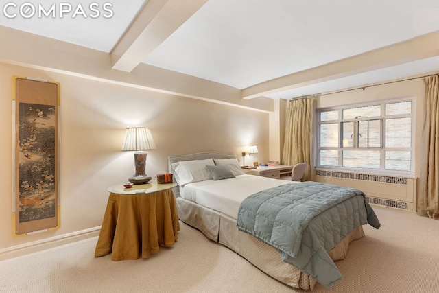 bedroom with carpet, radiator heating unit, and beamed ceiling