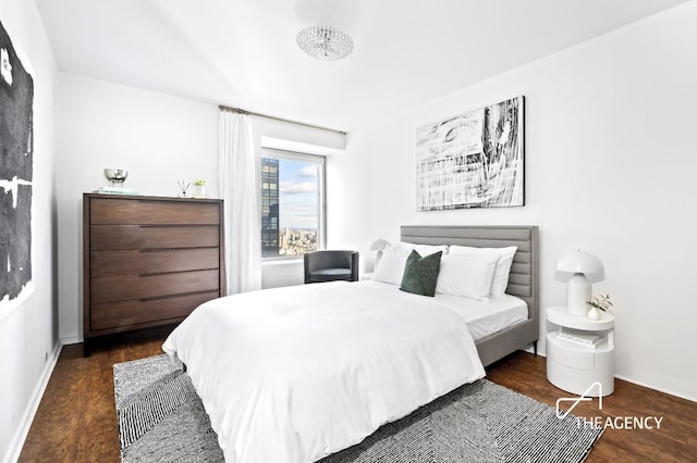 bedroom featuring dark hardwood / wood-style flooring