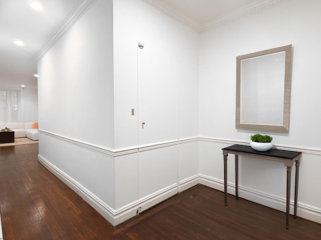 hallway featuring dark wood-style floors, recessed lighting, crown molding, and baseboards