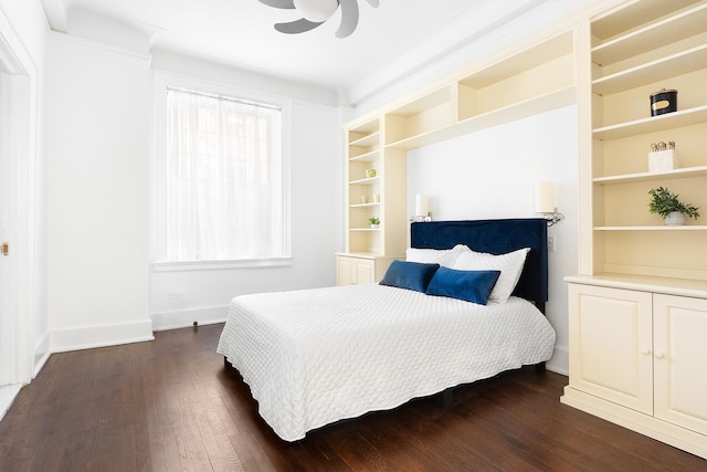 bedroom featuring dark wood-style floors, baseboards, and a ceiling fan