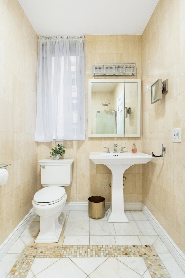 850 Park Ave Unit 1Dr, New York City, NY 10075 - bathroom featuring tile walls, toilet, tile patterned floors, and a shower