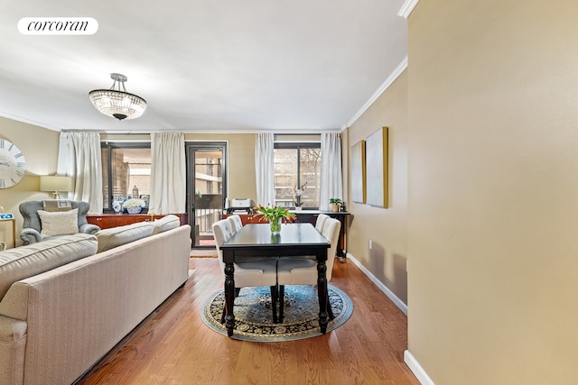 100 Beekman St Unit 4K, New York City, NY 10038 - living room featuring ornamental molding, baseboards, and wood finished floors
