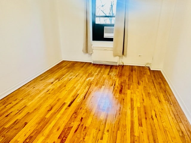 empty room with light hardwood / wood-style flooring