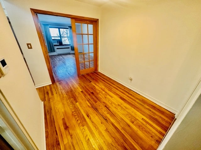 spare room with hardwood / wood-style flooring