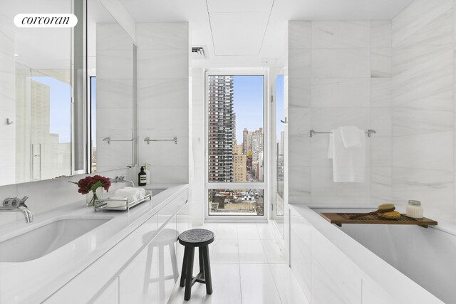 bathroom with vanity and tile patterned floors