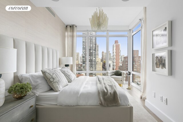 bedroom with light hardwood / wood-style flooring