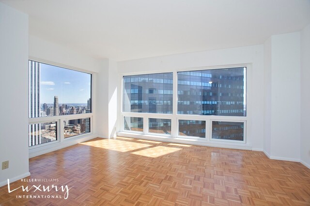 empty room with light parquet flooring