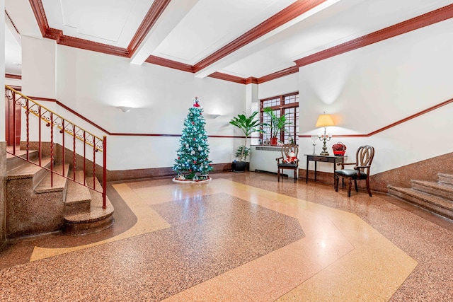 building lobby featuring stairway and ornamental molding
