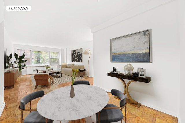 435 E 65th St Unit 3K, New York City, NY 10065 - dining room featuring baseboards