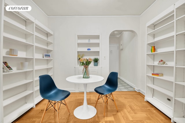 dining space featuring parquet flooring