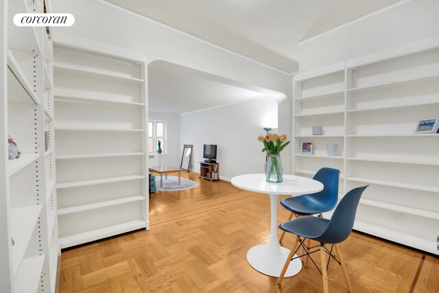 living room featuring parquet floors and ornamental molding