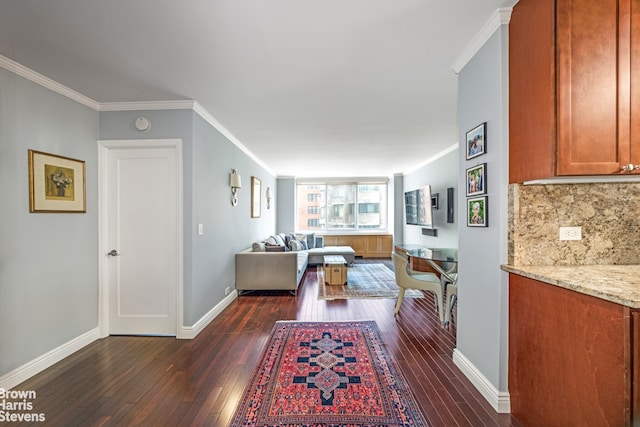 living room with dark hardwood / wood-style floors and crown molding