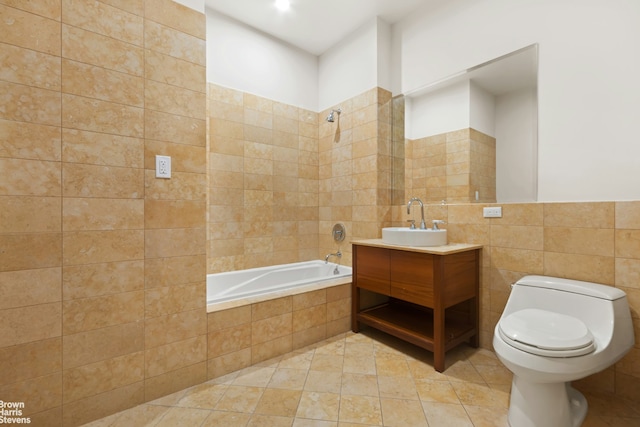 bathroom with tile patterned floors, tile walls, toilet, and vanity