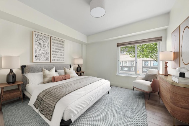 bedroom with hardwood / wood-style floors