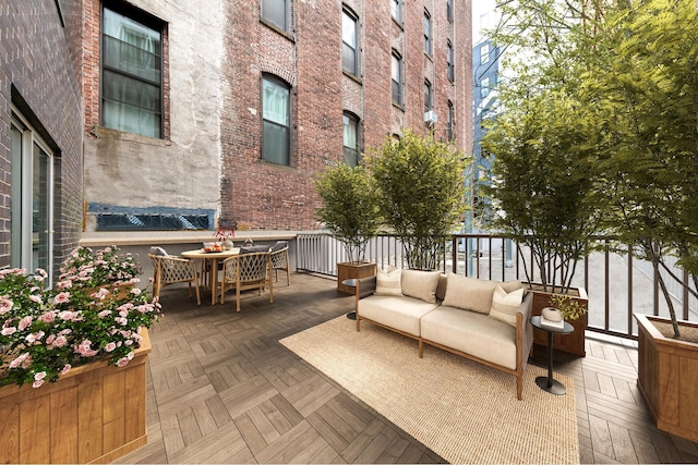 wooden deck with an outdoor living space