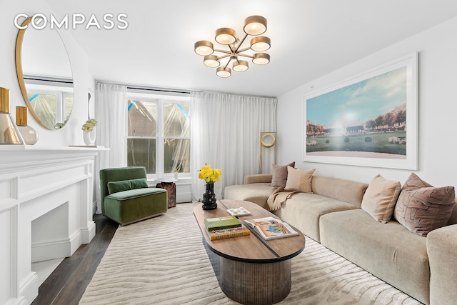 living area with an inviting chandelier and wood finished floors