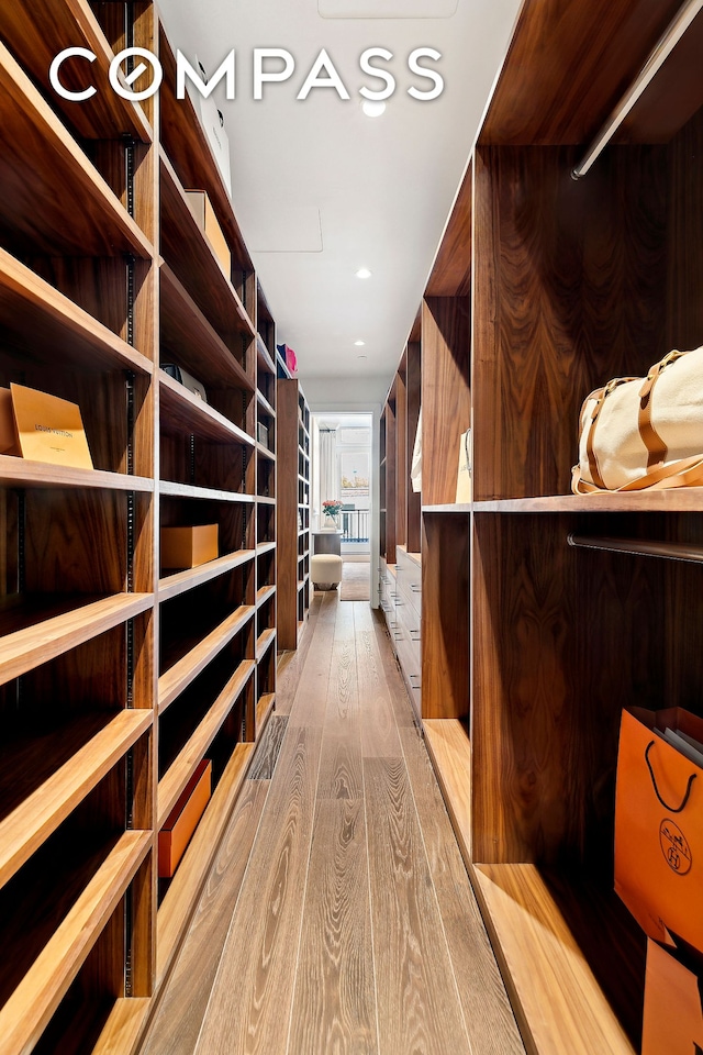 spacious closet with light wood-style floors