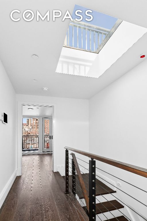 hallway featuring dark hardwood / wood-style floors