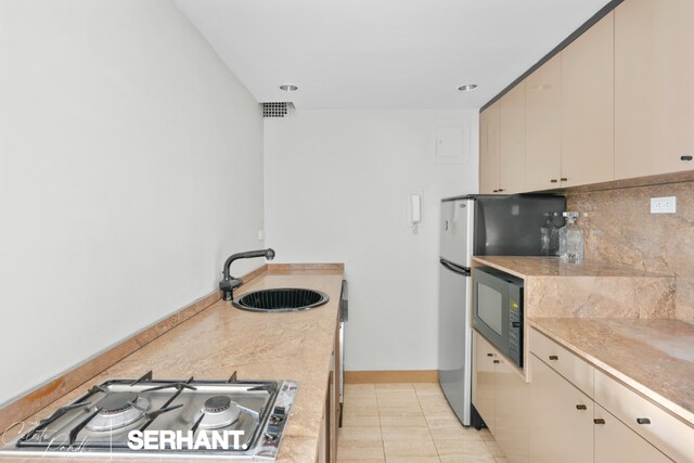 laundry area with stacked washer / dryer and washing machine and clothes dryer