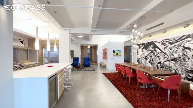 dining space featuring concrete flooring