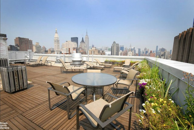 wooden terrace with a view of city