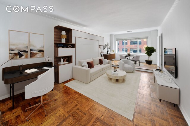 living room featuring crown molding and parquet flooring