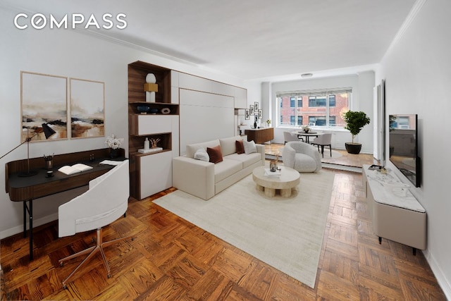 living room with ornamental molding and parquet floors