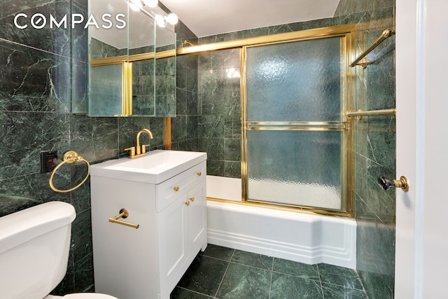 36 Sutton Pl S Unit 8E, New York City, NY 10022 - full bathroom featuring tile walls, vanity, and enclosed tub / shower combo